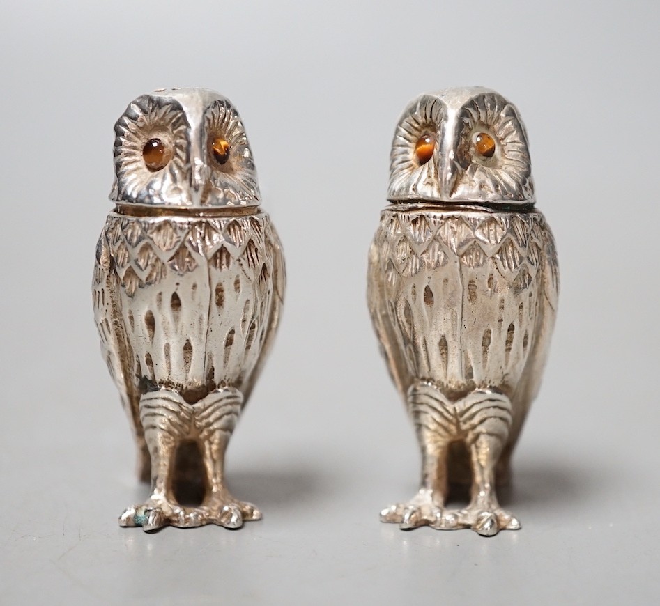 A modern novelty silver condiment, modelled as an owl and a similar unmarked companion, 52mm